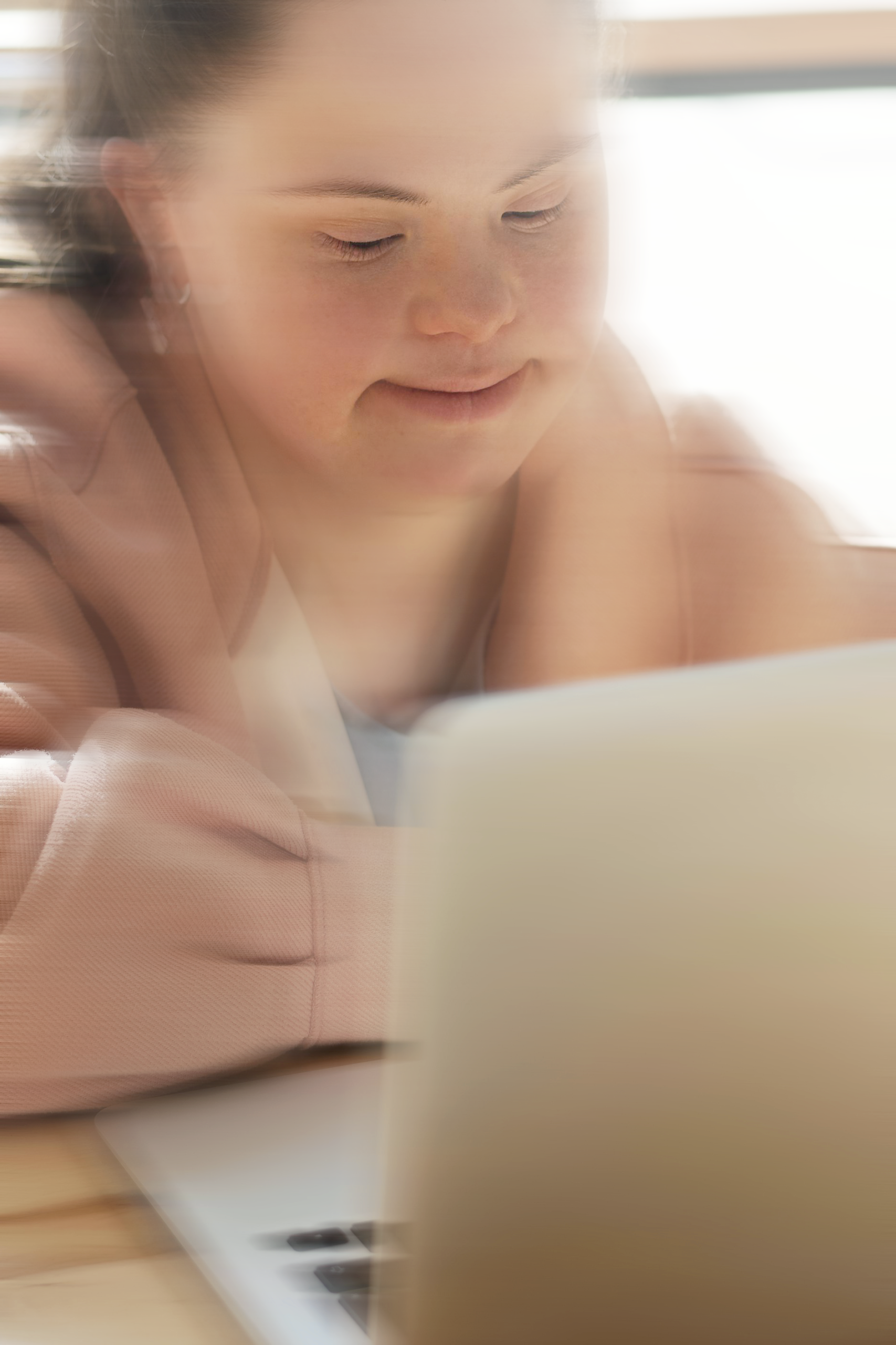 man in white top sitting on cliff